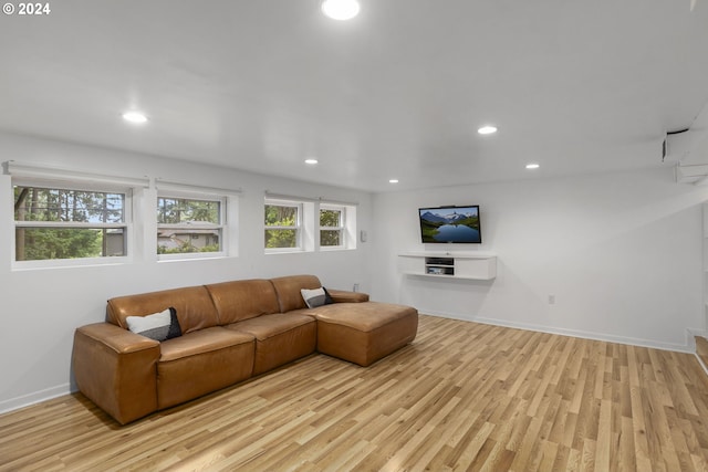 living room with light hardwood / wood-style floors