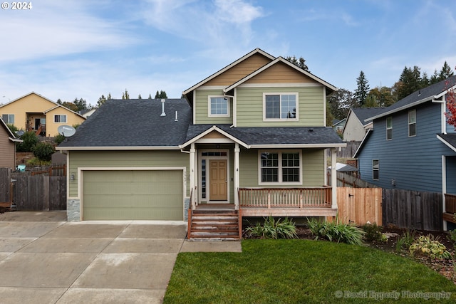 view of front of property featuring a garage and a front yard