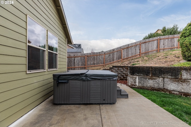 view of patio / terrace featuring a hot tub