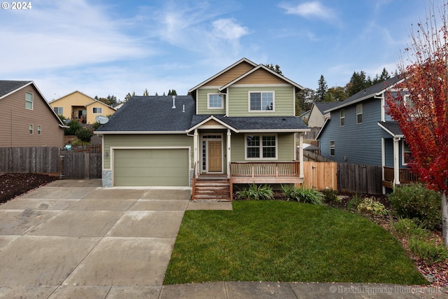 view of front facade with a garage and a front lawn