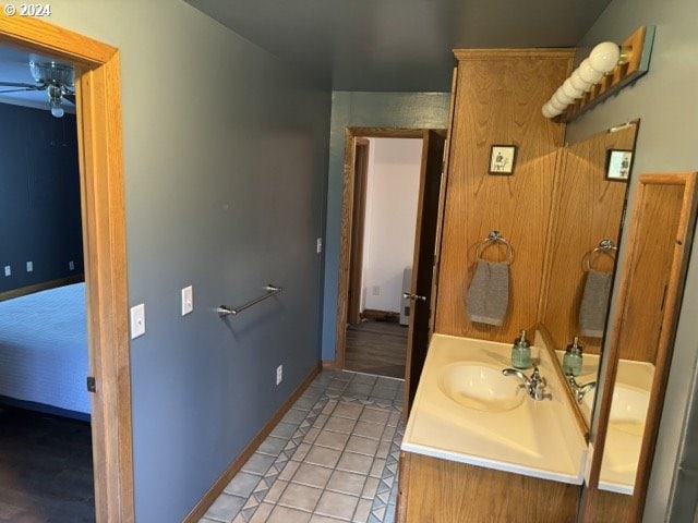 bathroom with ceiling fan, vanity, and tile patterned flooring