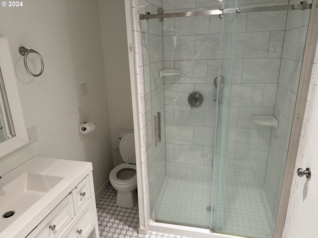 bathroom with vanity, toilet, and walk in shower