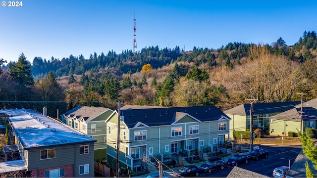 birds eye view of property with a residential view