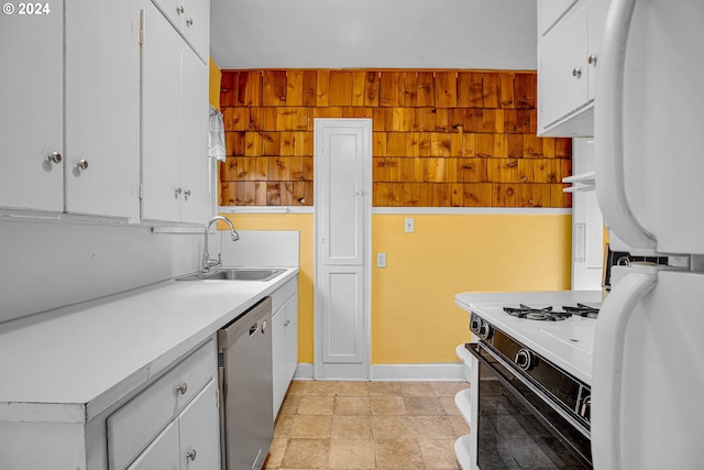 kitchen with stainless steel dishwasher, white cabinetry, and white gas range oven