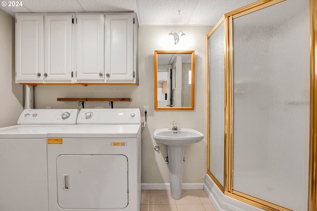 1175 Hines St SE, Salem, OR 97302 - laundry room with separate washer and dryer, light tile patterned flooring, and baseboards