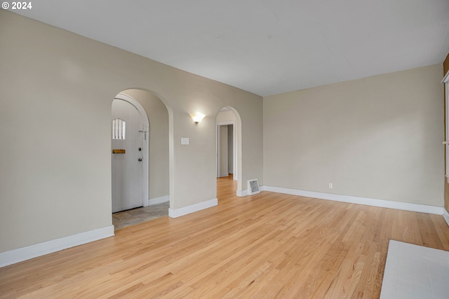 unfurnished room with light hardwood / wood-style floors