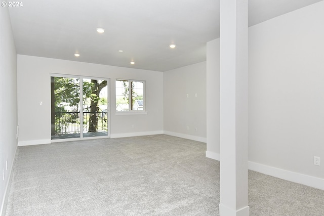 empty room with light colored carpet