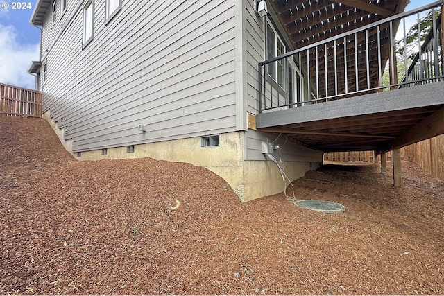 view of home's exterior featuring a wooden deck