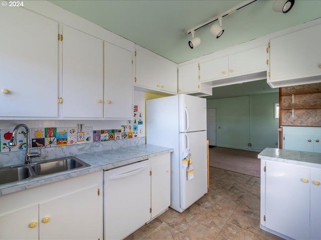 kitchen featuring white cabinets, white appliances, tasteful backsplash, and sink