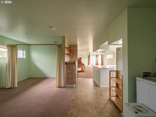 bonus room featuring light colored carpet and vaulted ceiling