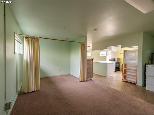 unfurnished living room with light carpet