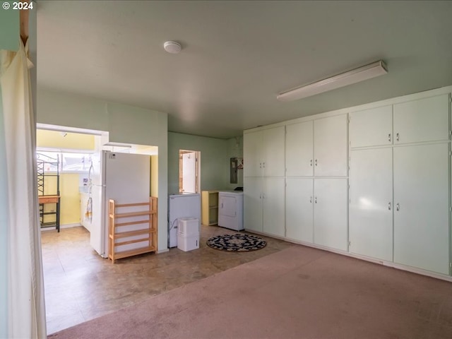 unfurnished bedroom featuring washer / clothes dryer, a closet, light colored carpet, and white fridge