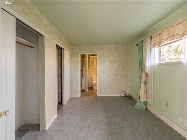 unfurnished bedroom featuring ensuite bath