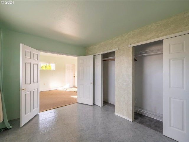 unfurnished bedroom featuring carpet floors