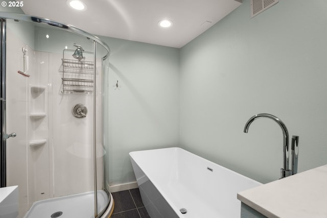 bathroom featuring vanity and separate shower and tub