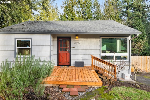 property entrance with a wooden deck