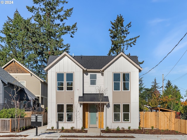 2519 NE Killingsworth St Unit 1, Portland, OR 97211 - modern inspired farmhouse with board and batten siding, roof with shingles, and fence