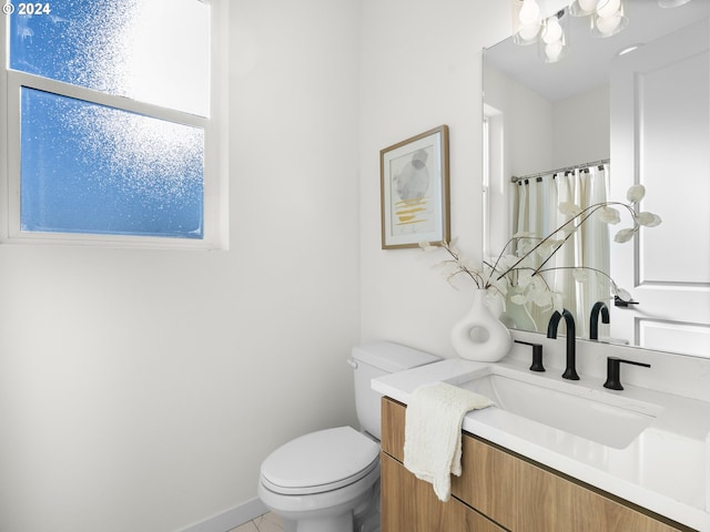 2519 NE Killingsworth St Unit 1, Portland, OR 97211 - bathroom with toilet, vanity, a shower with curtain, and tile patterned flooring