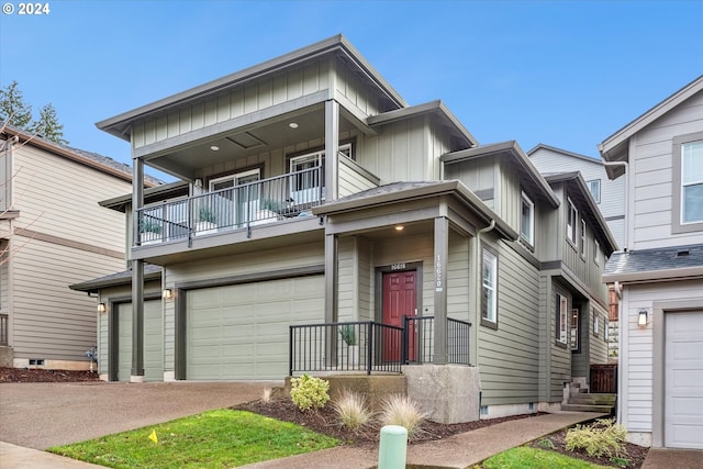 view of front of home with a garage and a balcony