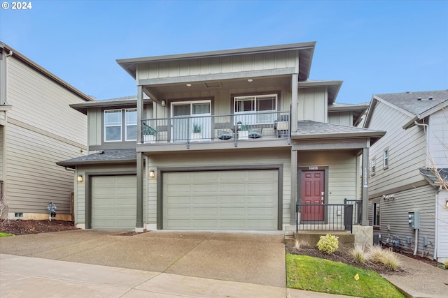 view of front facade with a balcony and a garage