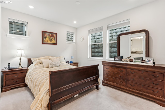 bedroom featuring light colored carpet