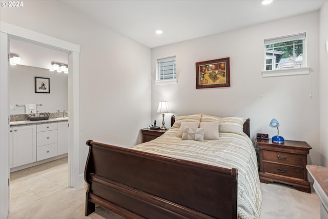 carpeted bedroom with ensuite bathroom