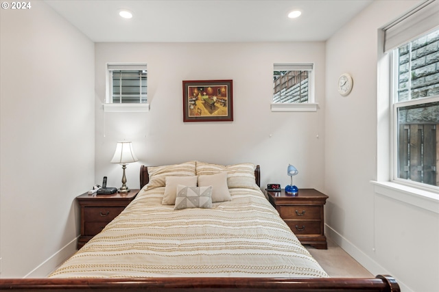 bedroom with light carpet