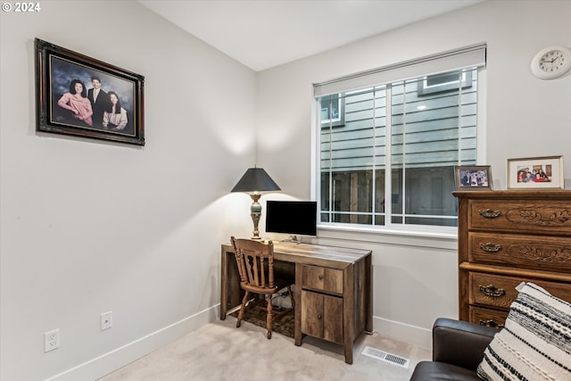 office area featuring light carpet