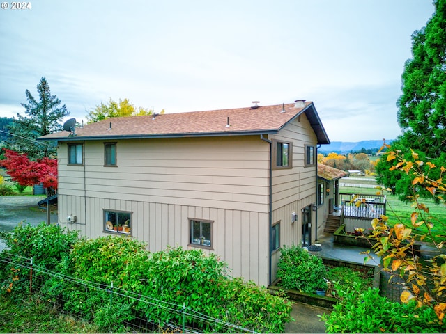 view of side of property with a deck