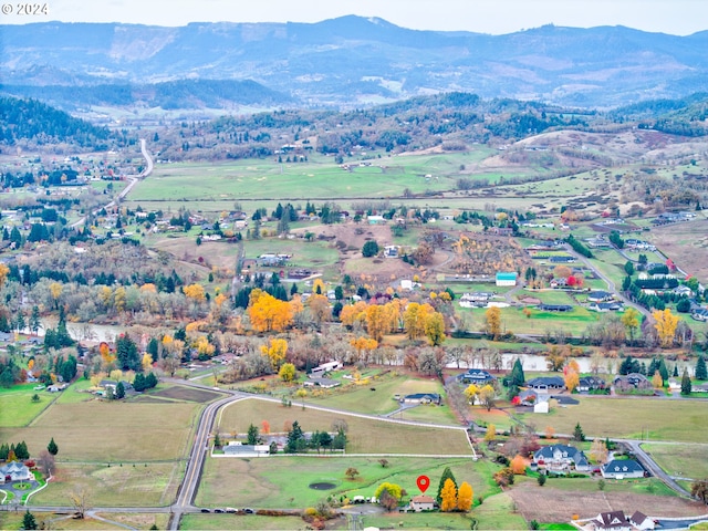 drone / aerial view with a mountain view and a rural view