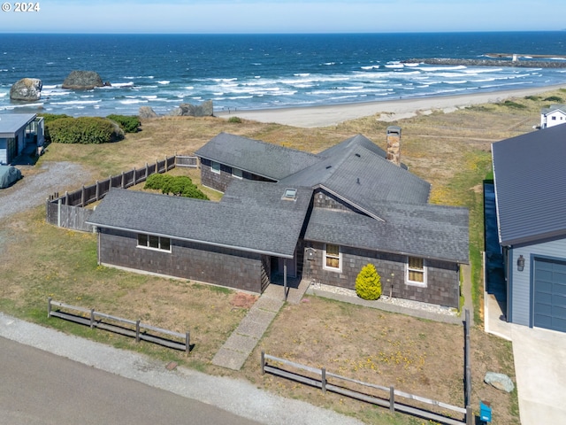 bird's eye view with a water view and a view of the beach