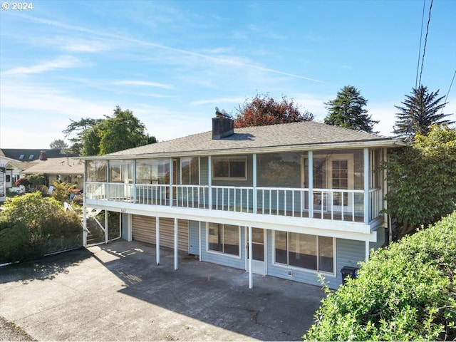 view of front facade with a patio and a balcony