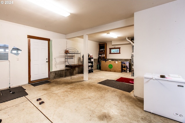 basement featuring white refrigerator