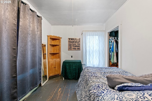 bedroom featuring a closet and dark hardwood / wood-style flooring