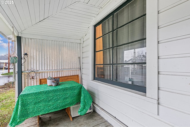 unfurnished sunroom featuring lofted ceiling