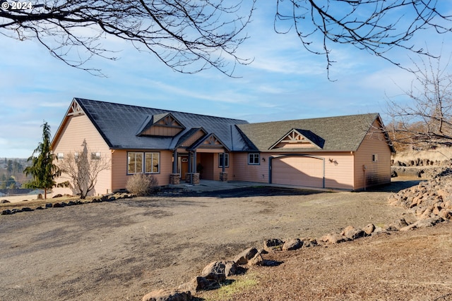 view of front facade with driveway and an attached garage