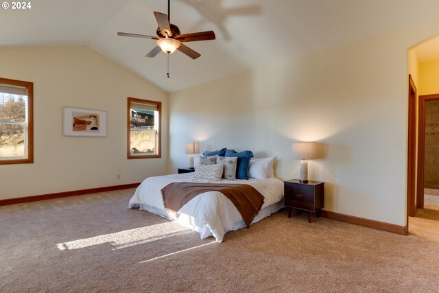 carpeted bedroom featuring ceiling fan and lofted ceiling