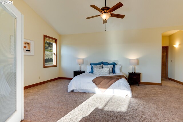 bedroom featuring light colored carpet, ceiling fan, and lofted ceiling