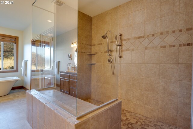 bathroom featuring tile patterned floors and plus walk in shower