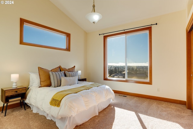 carpeted bedroom with lofted ceiling, multiple windows, visible vents, and baseboards