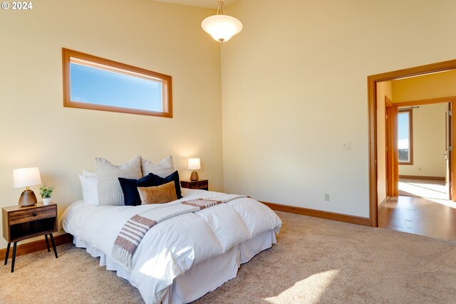 bedroom with light colored carpet