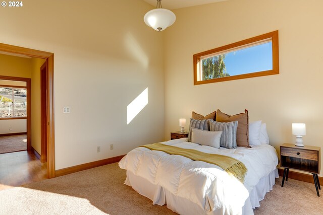 bedroom with light colored carpet