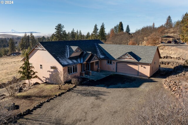 view of front of house with a mountain view and a garage