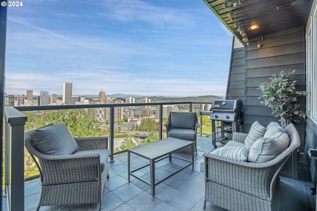 balcony featuring an outdoor living space and a grill