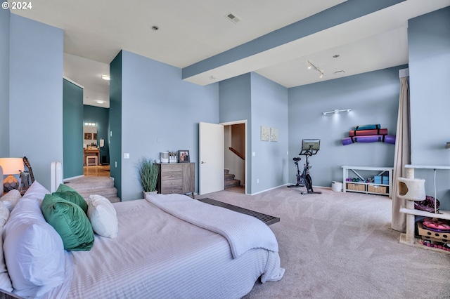 bedroom featuring light colored carpet