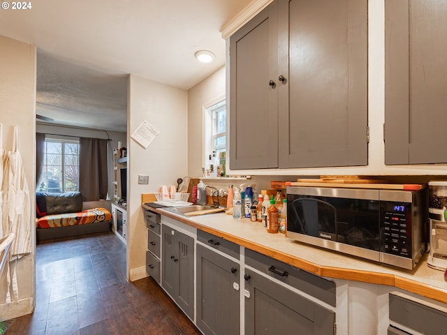 kitchen featuring sink and gray cabinetry