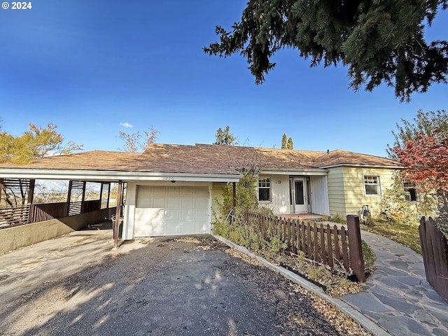 ranch-style home featuring a garage