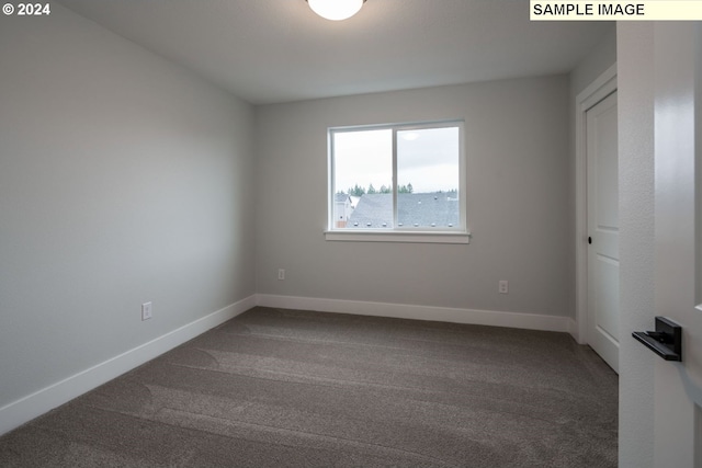 empty room with carpet flooring