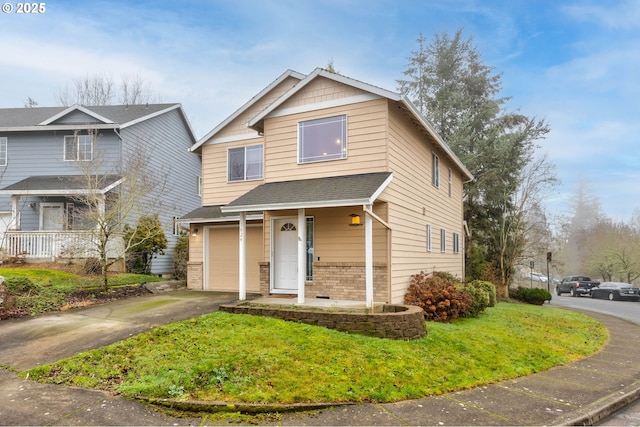 view of front of property with a garage and a front lawn