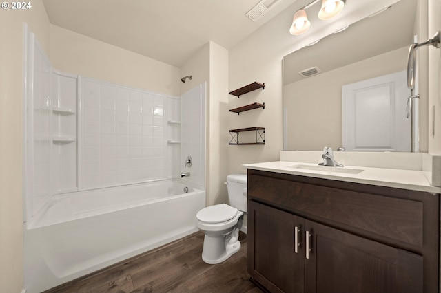 full bathroom with shower / bathtub combination, wood-type flooring, toilet, and vanity